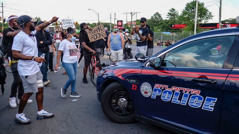 June 13, 2020 -  Atlanta -  Protestors gather at University Ave. at the Atlanta Wendy's where Rayshard Brooks, a 27-year-old Black man,  was shot and killed by Atlanta police Friday evening during a struggle in a Wendy's drive-thru line.    Ben Gray for the Atlanta Journal Constitution