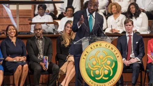 With U.S. Sen. Kelly Loeffler in the background, the Rev. Raphael G. Warnock speaks during the Martin Luther King, Jr. annual commemorative service at Ebenezer Baptist Church in Atlanta on Monday, Jan. 20, 2020. BRANDEN CAMP/SPECIAL