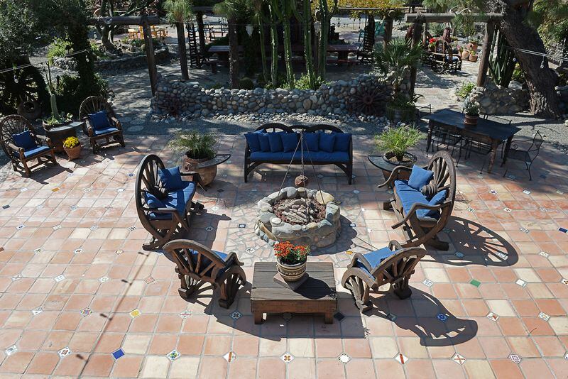 The expansive backyard at Karen Perez's Hanford home has a gas firepit built to look like an old west camp fire, as seen on Wednesday, Sept. 27, 2017. (Craig Kohlruss/Fresno Bee/TNS)