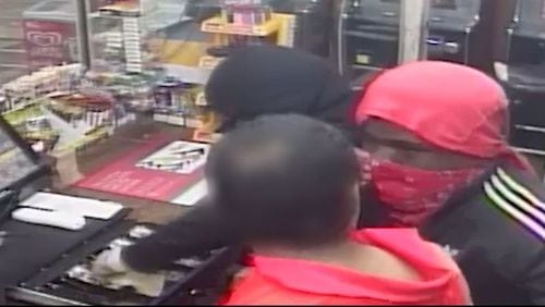 Two men with masks robbed the Exxon gas station on Metropolitan Parkway in Atlanta. (Credit: Atlanta Police Department)