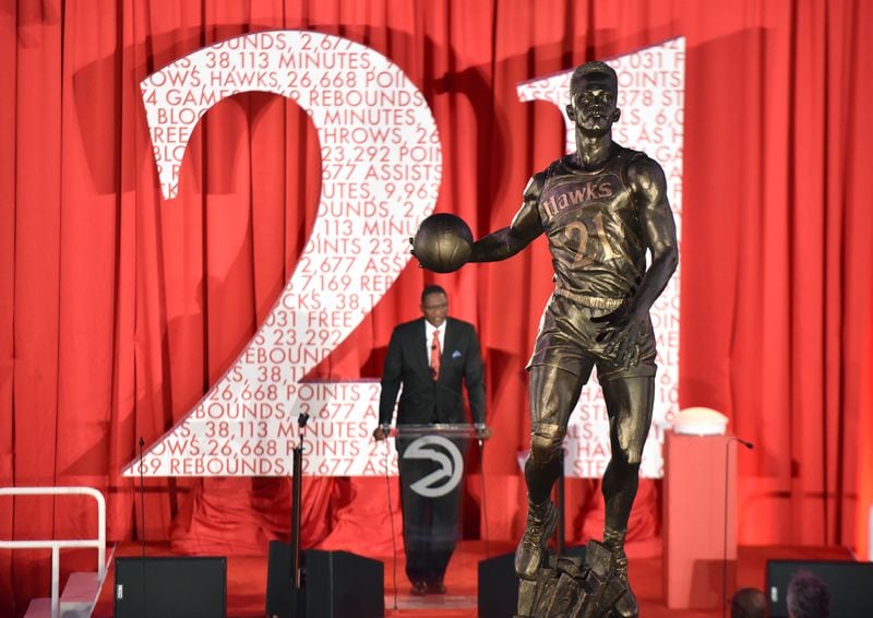 The Atlanta Hawks unveiled a large statue of Dominique Wilkins in 2015 at Philips Arena. Measuring 13½ feet in height, the granite statue was unveiled at a private luncheon and ceremony on the arena floor. (AJC file photo)