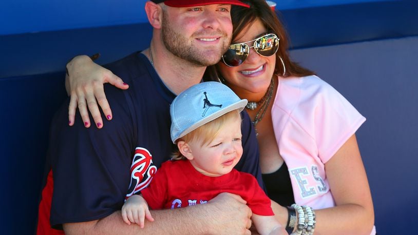 Braves catcher Brian McCann enjoys some family time with his wife Ashley and 1-year old son Colt on Sunday, August 11, 2013, in Atlanta at Turner Field.