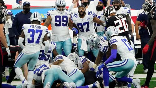 Dallas Cowboys defensive end Everson Griffen (97) reacts with teammates on the bench as defensive back C.J. Goodwin recovers an onside kick late in the fourth quarter against the Atlanta Falcons on Sunday, September 20, 2020 at AT&T Stadium in Arlington, Texas. (Smiley N. Pool/The Dallas Morning News/TNS)