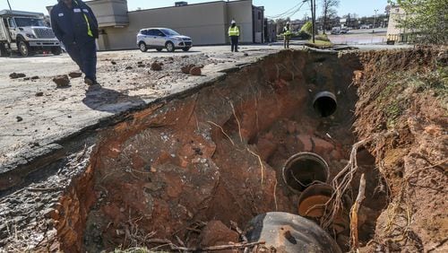 This is the site of a water main break that flooded Buford Highway just north of I-285 Wednesday and compromised water for hundreds of thousands of DeKalb County residents. JOHN SPINK/JSPINK@AJC.COM
