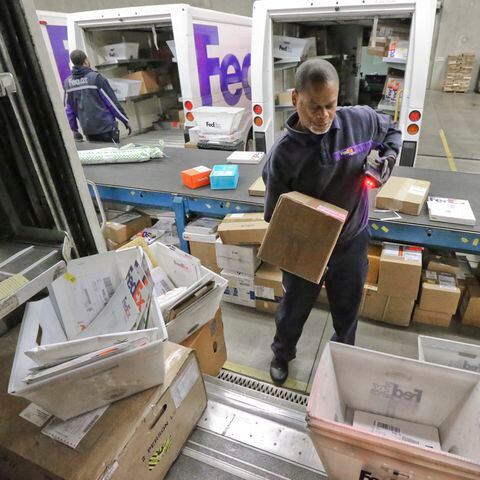 Delivery companies tackle holiday shipping