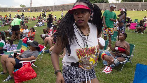 Jgenisius Harris dances to the music in her 1995  Freaknik shirt during the FreakNik 2019 concert at the Cellairis Amphitheatre at Lakewood Saturday, June 22, 2019. Harris said her family went to the 1995 Freaknik and she got the tee shirt.  STEVE SCHAEFER / SPECIAL TO THE AJC