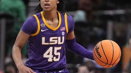 FILE - LSU's Alexis Morris controls the ball during an NCAA Women's Final Four semifinal basketball game against Virginia Tech, March 31, 2023, in Dallas. Former LSU star Morris knows firsthand how hard it is to make a WNBA roster. The guard was drafted in the second round by the Connecticut Sun a few weeks after helping the Tigers win their first championships in 2023, but was cut before the season started. (AP Photo/Darron Cummings, File)