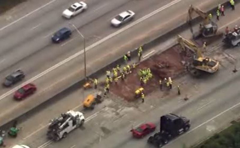 Crews were digging up concrete to repair a portion of damaged roadway on I-20 West in DeKalb County. (Credit: Channel 2 Action News)