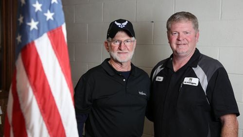 U.S. military veterans Lowell Hester, left, and his son Scott at their business, Mr. Transmission, Thursday, November 9, 2017, in Sandy Springs. Twice in the last three years, the Hester’s business, Mr. Transmission, have been named the Franchisee of the year. PHOTO / JASON GETZ