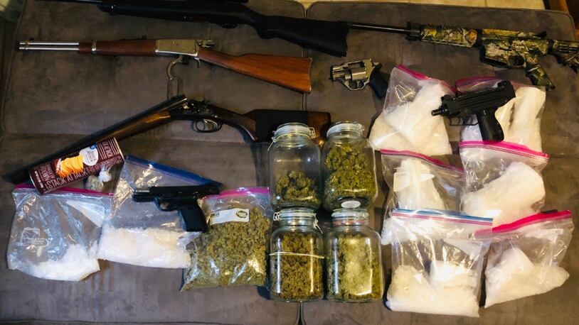 A sampling of items seized Tuesday during two Gwinnett County gang stash houses. (credit: Georgia Bureau of Investigation)