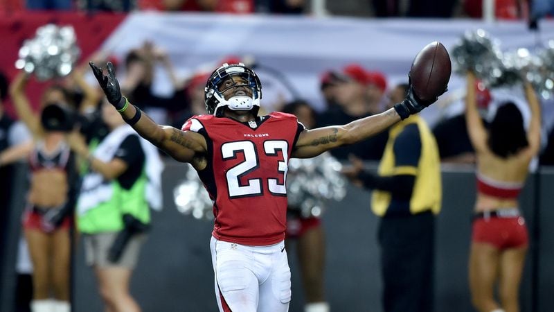 Atlanta Falcons cornerback Robert Alford celebrates after making his second interception in the 4th quarter against  the Carolina Panthers in the Georgia Dome Sunday, Oct. 2, 2016.