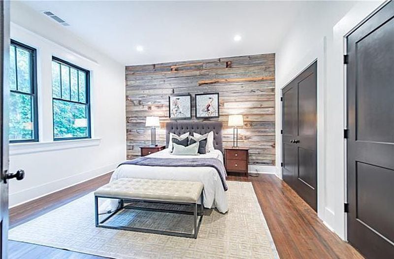 Reclaimed wood in the bedroom is part of the renovation of this Old Fourth Ward bungalow.