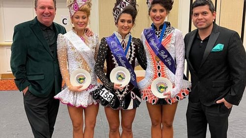 Karl Drake, founder of Drake School of Irish Dance, is shown here with three of his students who recently competed at Palmetto State Feis in Spartanburg, SC. The next stop for these 3 girls will be in Belfast for the upcoming World Championship of Irish Dancing. (Pictured L-R: Karl Drake, Danna Maki-Florida, Luisa Diaz-National champion from Drake Mexico, Ashlea DelFavero-Atlanta and Cesar Hernandez, husband of Drake).