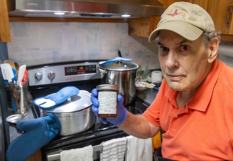 Mike Massey works on making one of his jam recipes in the kitchen of his Decatur home. He gives his homemade jams to the Lawrenceville co-op, a food bank serving Gwinnett County residents in Lawrenceville and Dacula. PHIL SKINNER FOR THE ATLANTA JOURNAL-CONSTITUTION