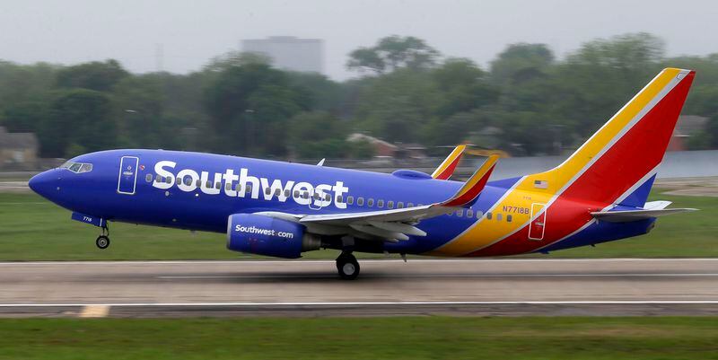 FILE- In this April 23, 2015, file photo, a Southwest airlines jet takes off from a runway at Love Field in Dallas. Southwest Airlines is asking travelers on Sunday, Oct. 11, to arrive at least two hours before their scheduled departures as technical issues are forcing it to check-in some customers manually. (AP Photo/LM Otero, File)
