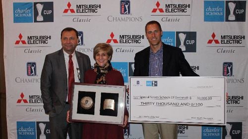 Stan Hall, Executive Director of the Mitsubishi Electric Classic and Gwinnett Sports Commission, Susie Collat, Chairman Special Needs Schools of Gwinnett, and Monte Ortel, Tournament Director, Mitsubishi Electric Classic (from left to right) presented a $30,000 check on Wednesday.
