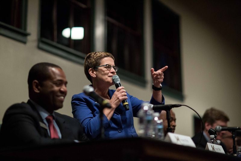Former Atlanta City Council President Cathy Woolard (center) talks during an Inman Park mayoral candidate forum in The Trolley Barn, Wednesday, Oct. 4, 2017, in Atlanta. BRANDEN CAMP / SPECIAL