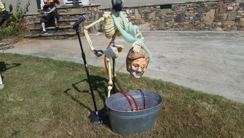A Halloween display in Marietta depicts a severed head of presidential candidate Hillary Clinton.