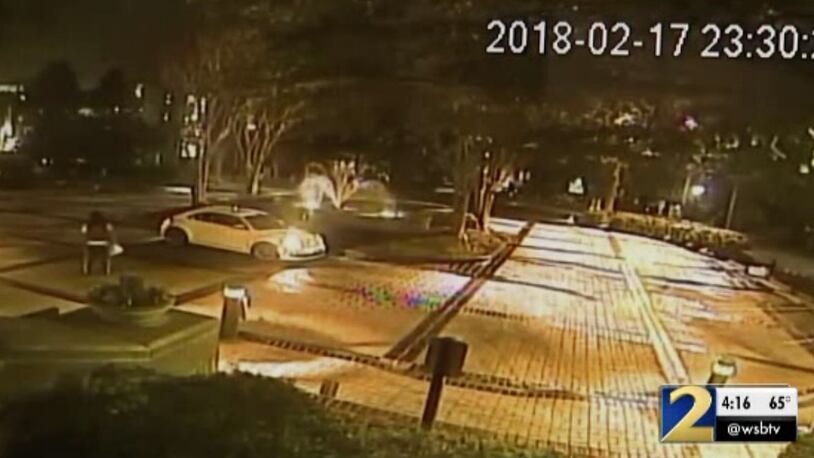 This is a screenshot of surveillance footage of the moments before an Uber Eats customer was fatally shot in Buckhead.
