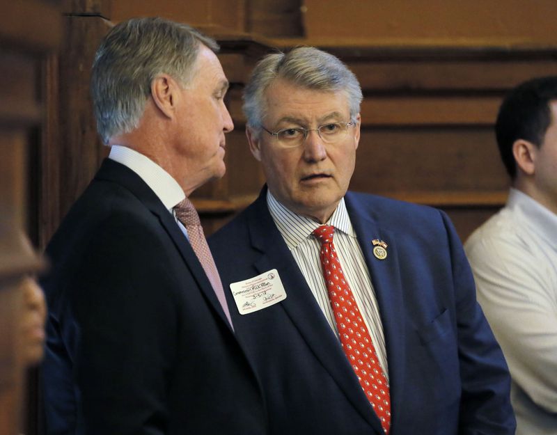 U.S. Rep. Rick Allen, R-Augusta (right) was added to the Energy and Commerce Committee this week. In this file photo, he is pictured speaking to former Sen. David Perdue. (AJC file photo)