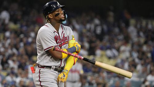 Ronald Acuna Jr. of the Braves tosses his bat after walking during the first inning of a baseball game against the Los Angeles Dodgers Friday, Sept. 1, 2023, in Los Angeles. (AP Photo/Mark J. Terrill)