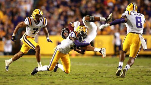 Kary Vincent #5 of the LSU Tigers tackles Kellen Mond #11 of the Texas A&M Aggies at Tiger Stadium on November 30, 2019 in Baton Rouge, Louisiana. (Photo by Sean Gardner/Getty Images)