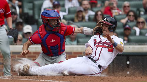 Atlanta Braves’ Luke Williams is tagged out at home by Philadelphia Phillies catcher Garrett Stubbs (21) to end the ninth inning at Truist Park, Wednesday, September 20, 2023, in Atlanta. The Phillies won 6-5 in the 10th inning against the Braves. (Jason Getz / Jason.Getz@ajc.com)