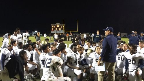 Dacula coach Tommy Jones talks to his players after the 41-7 win over Lanier.