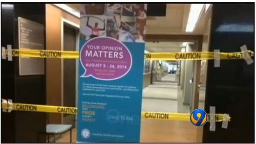 A hospital corridor in Charlotte was cordoned off while a patient suspected of having Ebola was examined. (Image from