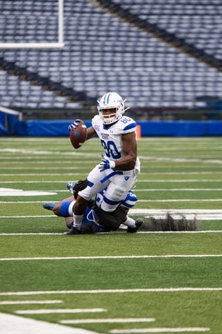 Matlin Marshall (80), white team wide receiver, gets tackled after catching a pass during the Georgia State University spring football game on Friday, April 16, 2021, at Center Parc Stadium in Atlanta. The white team defeated the blue team 23-17. CHRISTINA MATACOTTA FOR THE ATLANTA JOURNAL-CONSTITUTION