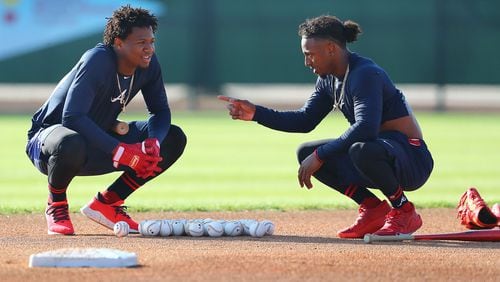 Braves outfielder Ronald Acuna and infielder Ozzie Albies get in some work during spring training in February. (Curtis Compton/ccompton@ajc.com)