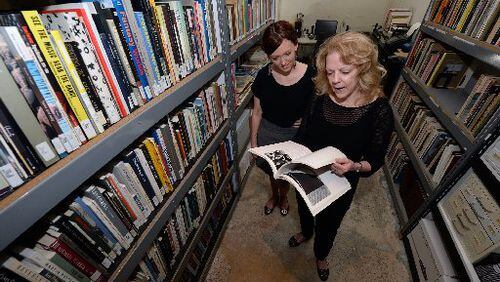 Shana Barefoot (left) and Annette Cone-Skelton in the Education/Resource Center, a library and archive documenting the work of Georgia artists, inside the Museum of Contemporary Art of Georgia before its 2014 expansion. AJC FILE PHOTO, 2013