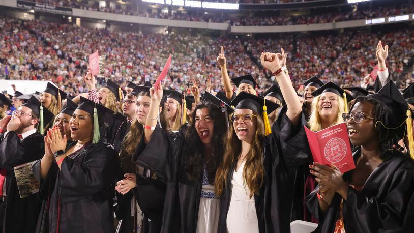 University of Georgia students react during the closing ceremony of the Spring undergraduate commencement at Sanford Stadium, Friday, May 12, 2023, in Athens. (Jason Getz / Jason.Getz@ajc.com)