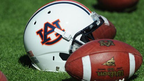 A helmet and footballs of the Auburn Tigers are on the field before play against the Chattanooga Mocs Nov. 6, 2010, at Jordan-Hare Stadium in Auburn, Ala.