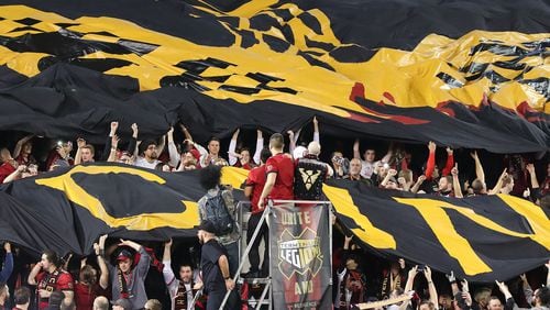 Fans unfurl the Atlanta United RC tifo to open the action against the New York Red Bulls Sunday.