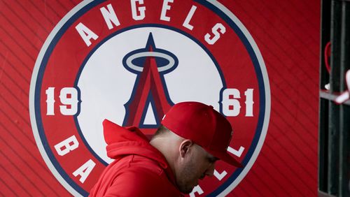 Los Angeles Angels center fielder Mike Trout leaves the dugout before a baseball game against the Philadelphia Phillies, Tuesday, April 30, 2024, in Anaheim, Calif. (AP Photo/Ryan Sun)