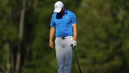 Jordan Spieth slumps after hitting the first of two shots to find Rae’s Creek during the final round of last year’s Masters. (Curtis Compton/ccompton@ajc.com)