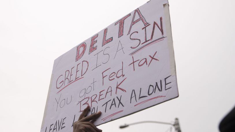 Delta Air Lines is under fire for proposed Georgia legislation that would excuse it and other carriers and cargo airlines from paying taxes tied to jet fuel sales. Local school students and leaders recently protested the proposal at the entrance to Delta’s headquarters. A chunk of the current tax goes to local government and schools in Clayton County. ALYSSA POINTER/ALYSSA.POINTER@AJC.COM