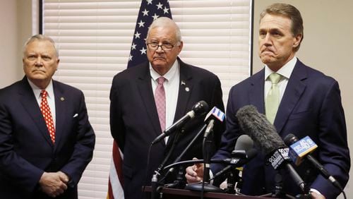 Georgia GOP Chairman John Padgett (center), appearing with U.S. Sen. David Perdue (right) and Gov. Nathan Deal, will step down as the state party’s leader in 2017. The state Republican Party continues to deal with financial problems, reporting about $126,000 in cash on hand and roughly $227,000 in debt. In 2010, it had about $2 million in the bank. BOB ANDRES / BANDRES@AJC.COM