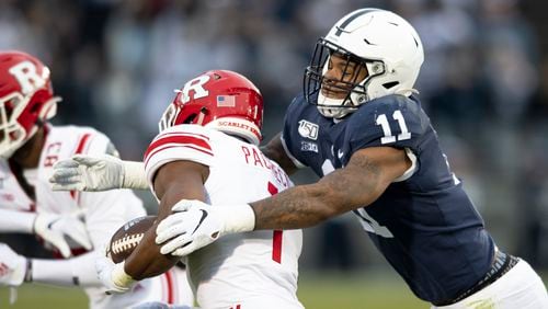 Penn State linebacker Micah Parsons (11) tackles Rutgers tight end Johnathan Lewis (11) in the first quarter Nov. 30, 2019, in State College, Pa. Penn State All-American Micah Parsons is opting out of the 2020 season because of concerns about COVID-19. The junior linebacker made his announcement with a social media post Thursday, Aug. 6, 2020. (Barry Reeger/AP)