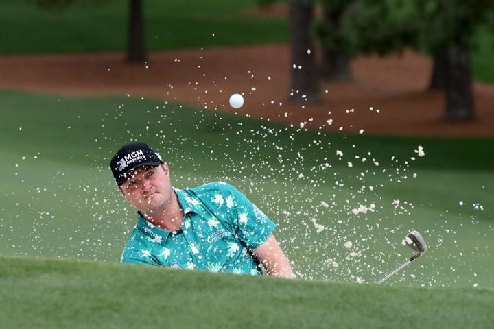 April 9, 2021, Augusta: Jason Kokrak hits out of the bunker on the seventh hole during the second round of the Masters at Augusta National Golf Club on Friday, April 9, 2021, in Augusta. Curtis Compton/ccompton@ajc.com