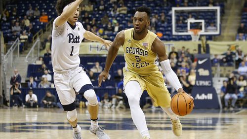 Georgia Tech guard Josh Okogie (5) drives to the basket past Pittsburgh guard Parker Stewart (1) during the first half of an NCAA college basketball game, Saturday, Jan. 13, 2018, in Pittsburgh. (AP Photo/Jared Wickerham)