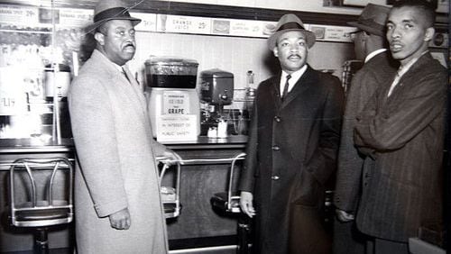 Rev. Ralph David Abernathy (left) and Rev. Martin Luther King Jr. (center) stand at a lunch counter in the early 1960s. On Feb. 16, learn about renovation plans for the historic West Hunter Street Baptist Church of which Abernathy was the pastor from 1961 to 1973. Contributed