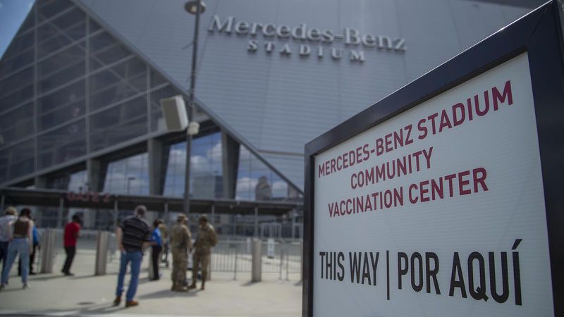 People flocked to mass vaccination sites, like this one at Mercedes Benz stadium, which accepts walk-ups. (Alyssa Pointer / Alyssa.Pointer@ajc.com)