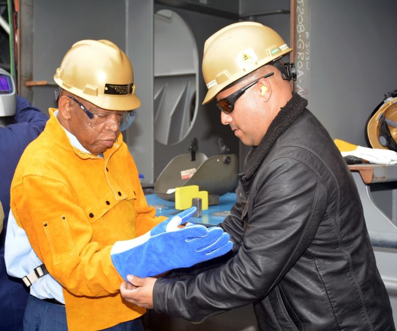 Rep. John Lewis (D Ga.) dons protective gear as he prepares to weld his initials into the keel plate of his namesake ship during the keel laying ceremony of USNS John Lewis at the General Dynamics Shipyard in San Diego.