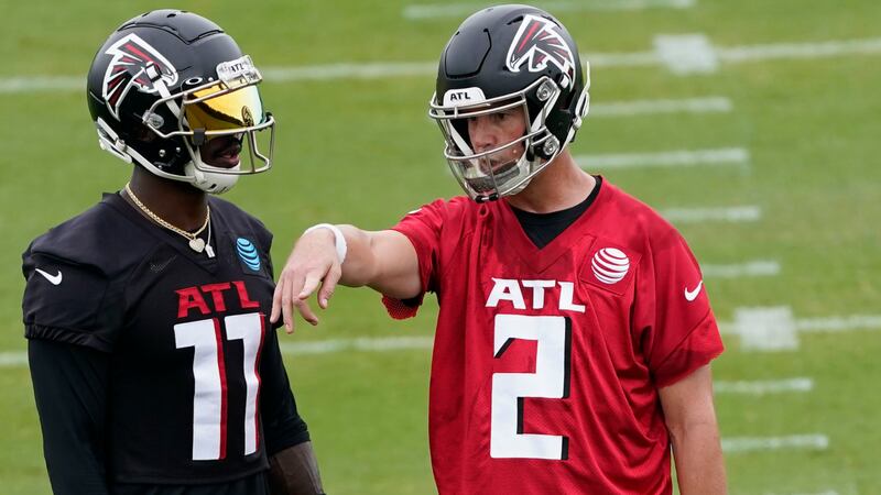 Falcons wide receiver Julio Jones (11) and quarterback Matt Ryan (2) talk during an NFL football training camp practice Thursday, Aug. 13, 2020, in Flowery Branch. (John Bazemore/AP)