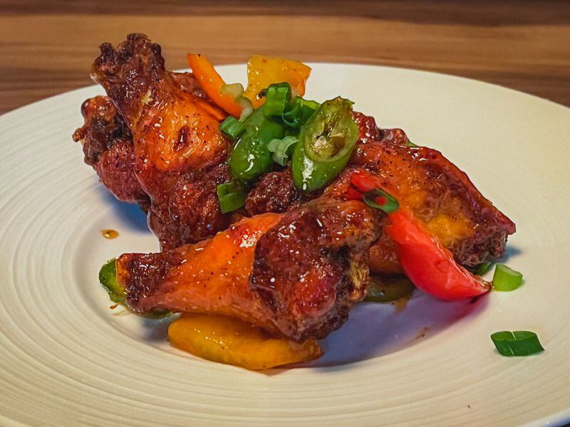 Vietnamese-style chicken wings are among the menu offerings at Mai Kitchen in Atlanta's Virginia-Highland neighborhood. Henri Hollis/henri.hollis@ajc.com