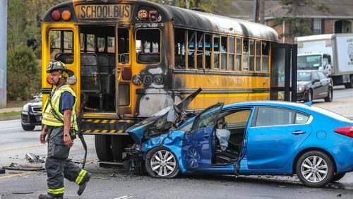 A driver faces charges after causing a fiery school bus crash Thursday morning, March 30, 2017 Sandy Springs police said. Students walked away with only bumps and bruises in the accident, which shut down most of Roswell Road, according to the WSB 24-hour Traffic Center.