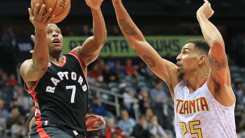 ATLANTA: -- Raptors guard Kyle Lowry takes it to the basket past Hawks guard Thabo Sefolosha for two of his 31-points during the second half in a basketball game on Wednesday, Dec. 2, 2015, in Atlanta. The Raptors beat the Hawks 96-86. Curtis Compton / ccompton@ajc.com