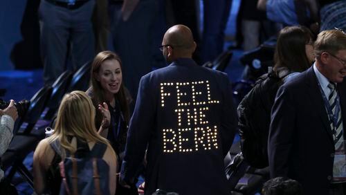 A delegate's jacket lights up in support of Bernie Sanders inside the Wells Fargo Center on the first day of the Democratic National Convention in Philadelphia, July 25, 2016. (Jim Wilson/The New York Times)